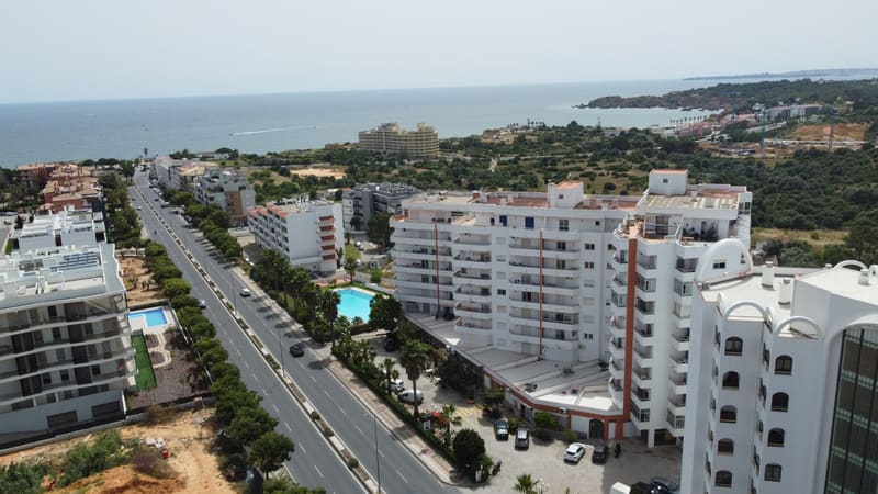 Aerial view of the road towards the beach and the Praia da Rocha cliffs
